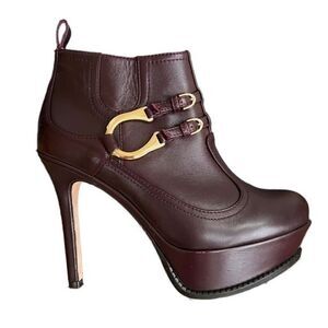 Dione plum Leather high heels platform booties 4.5” Heel 1.5” Platform size 7.5.